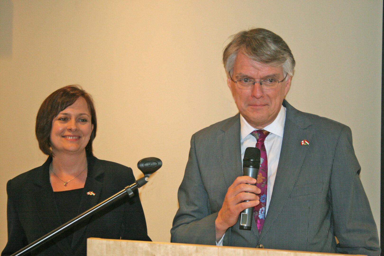 Ambassador Pierre Guimond introducing the author, Susan M. Papp. On Ambassador Guimond's right side is consular officer Eniko Lantos.
